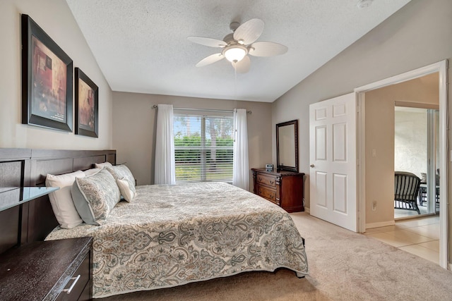 carpeted bedroom featuring a textured ceiling, access to outside, ceiling fan, and vaulted ceiling