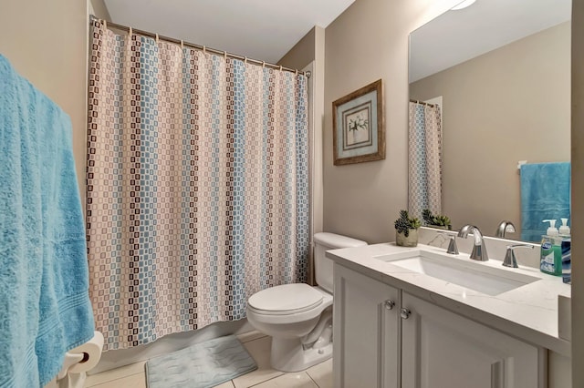 bathroom with vanity, tile patterned floors, and toilet