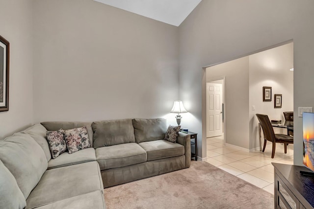 tiled living room with high vaulted ceiling