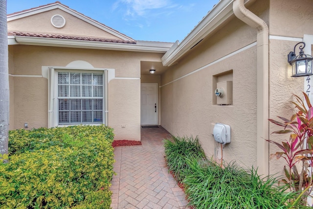 entrance to property with a patio area