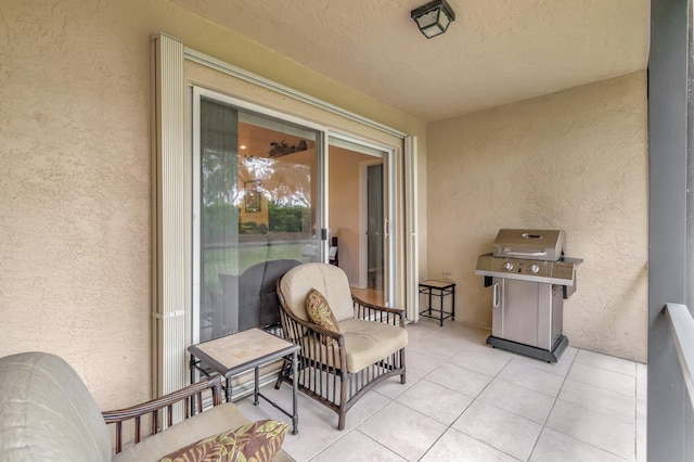 balcony featuring area for grilling and a patio area