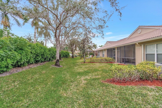 view of yard with a sunroom