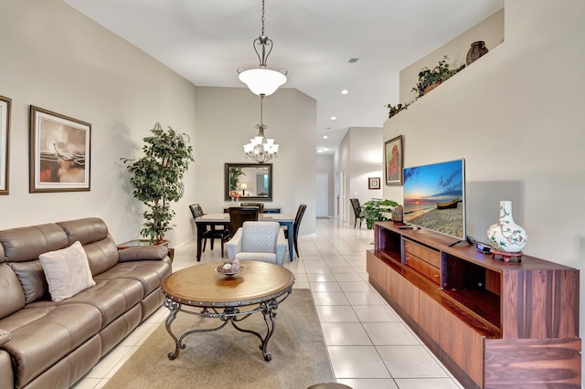 living room featuring light tile patterned floors and an inviting chandelier