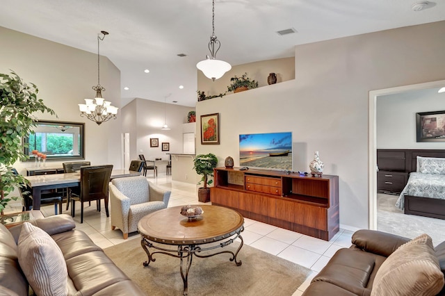 tiled living room with a notable chandelier and a high ceiling