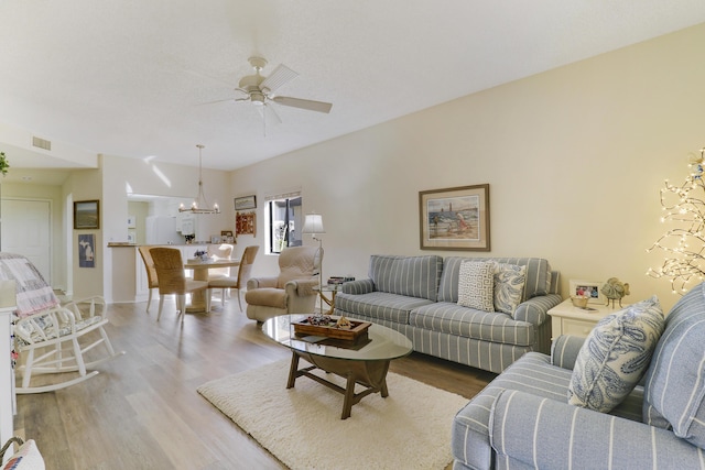 living room with ceiling fan and wood-type flooring