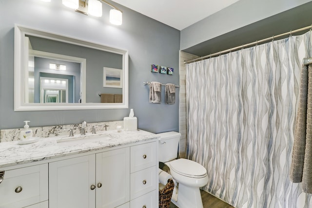 bathroom with a shower with curtain, vanity, toilet, and hardwood / wood-style floors