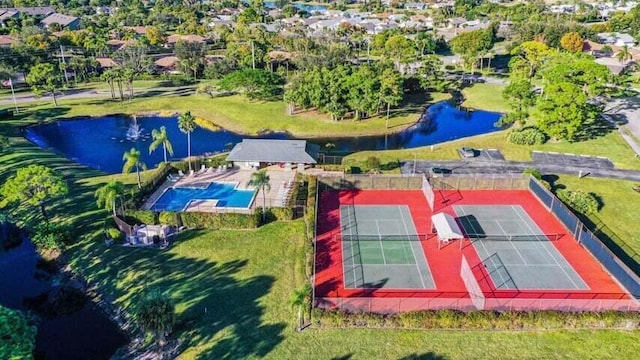 birds eye view of property featuring a water view