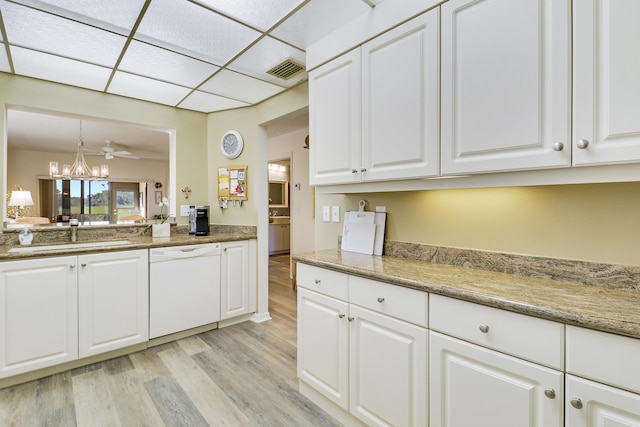 kitchen with white cabinets, dishwasher, pendant lighting, and sink