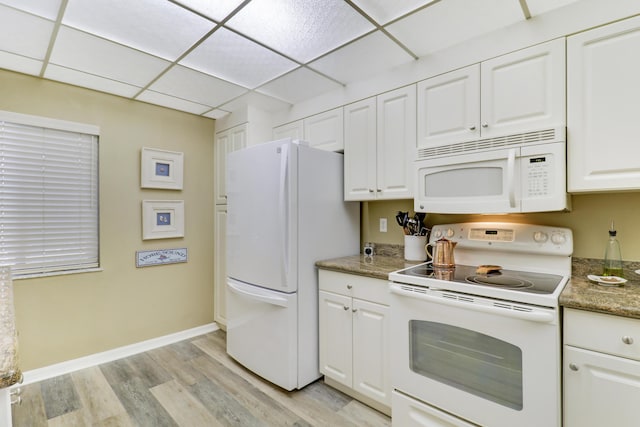 kitchen featuring a drop ceiling, white cabinets, white appliances, and light hardwood / wood-style flooring