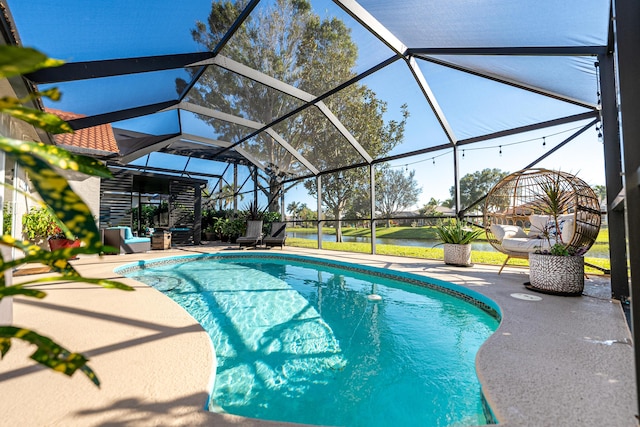 view of pool featuring a patio area and glass enclosure