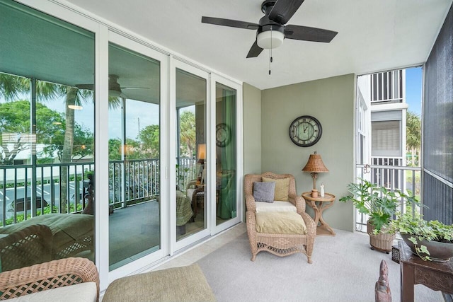 sunroom featuring ceiling fan