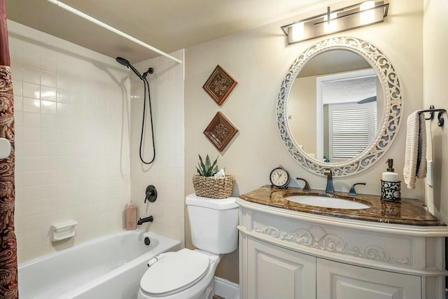 full bathroom with vanity, toilet, and tiled shower / bath