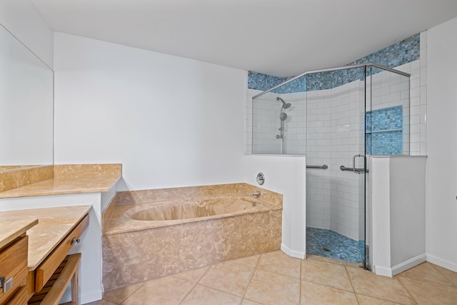 bathroom with shower with separate bathtub, vanity, and tile patterned floors