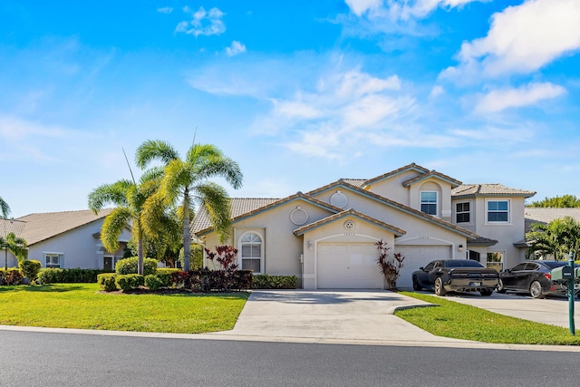 view of front of house featuring a front yard and a garage