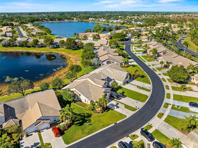 drone / aerial view with a water view