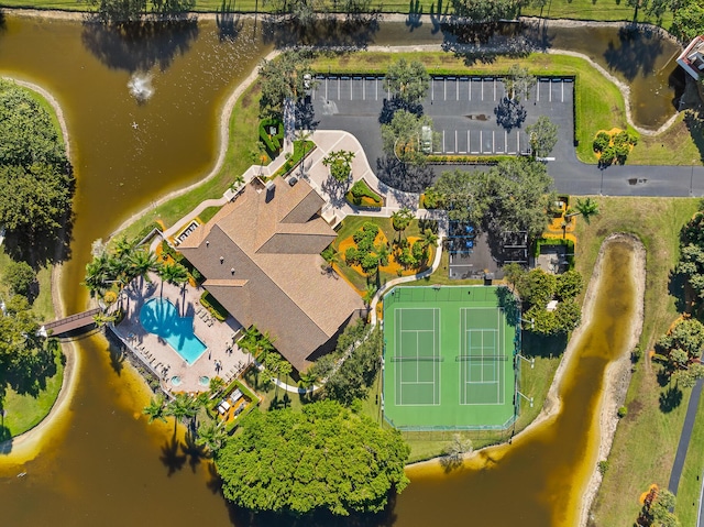 birds eye view of property with a water view