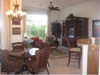 dining room featuring ceiling fan with notable chandelier and ornamental molding