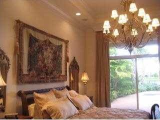 bedroom with access to exterior and an inviting chandelier