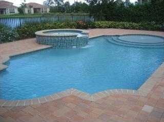 view of pool featuring an in ground hot tub