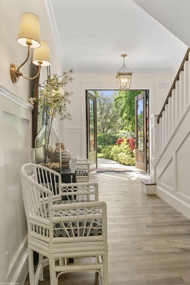 foyer entrance featuring a chandelier and hardwood / wood-style floors