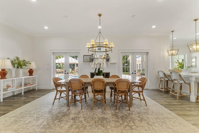 dining space with crown molding, french doors, and dark wood-type flooring