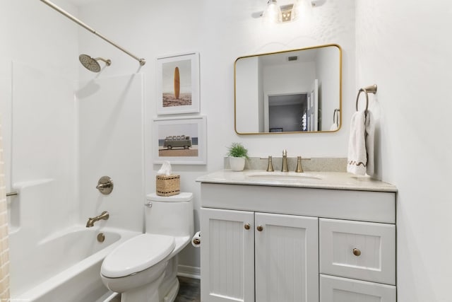 full bathroom featuring vanity, toilet, and washtub / shower combination