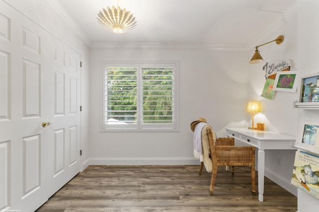 office space featuring hardwood / wood-style floors, ornamental molding, and a notable chandelier