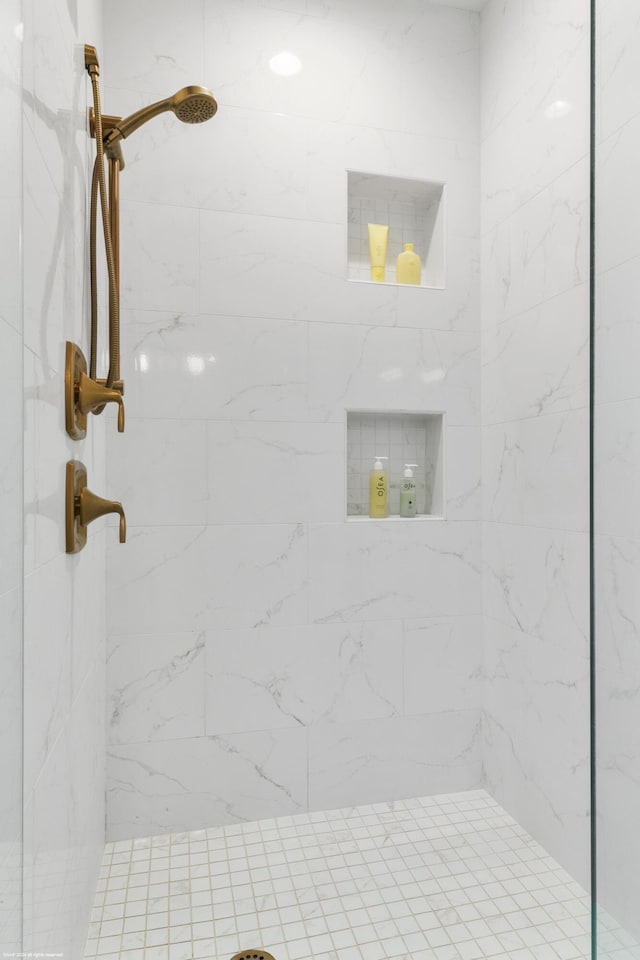 bathroom with tiled shower