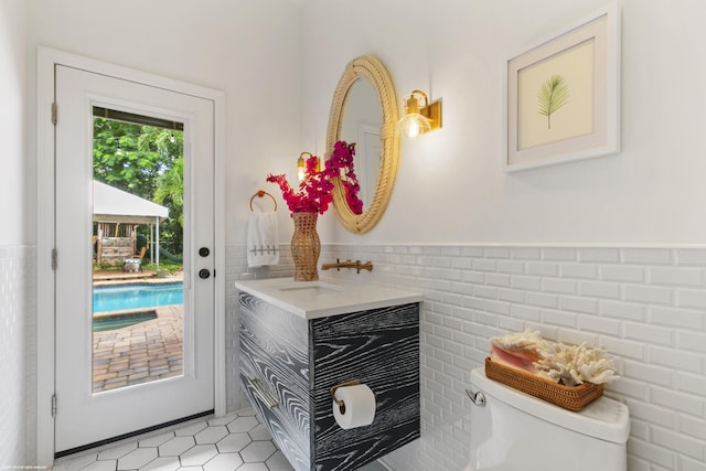 interior space with sink and tile walls