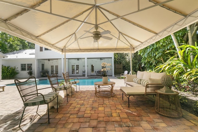 view of patio / terrace featuring french doors, an outdoor hangout area, ceiling fan, and a gazebo