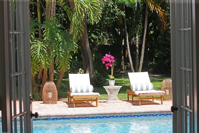 view of pool featuring a patio