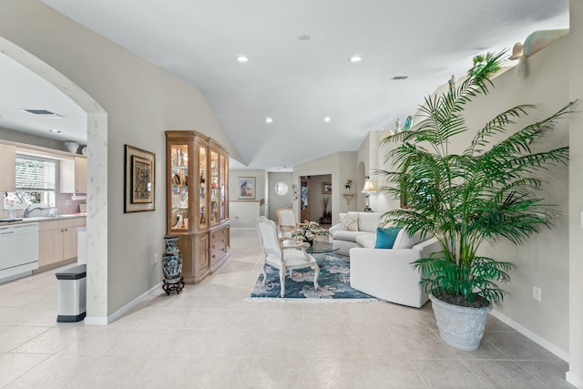 living room featuring light tile patterned floors and lofted ceiling