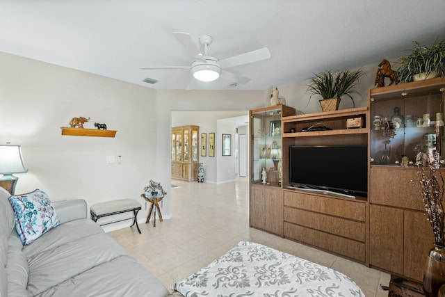 living room featuring ceiling fan and light tile patterned floors