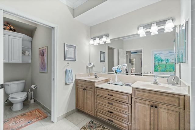 bathroom featuring tile patterned floors, vanity, and toilet