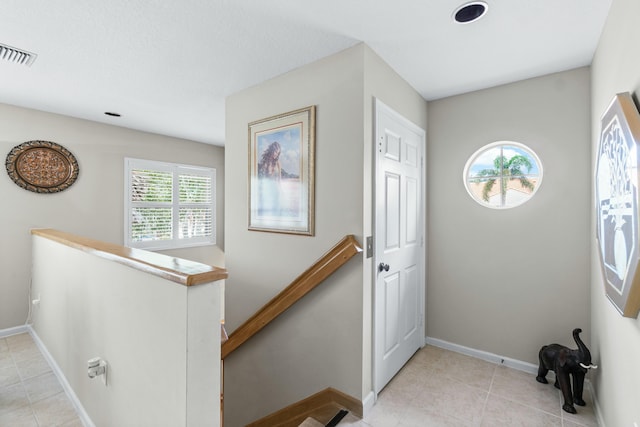 entrance foyer with light tile patterned floors