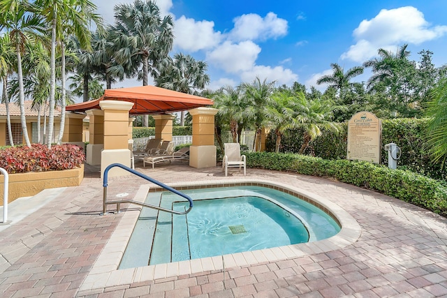 view of swimming pool with a gazebo and a patio area