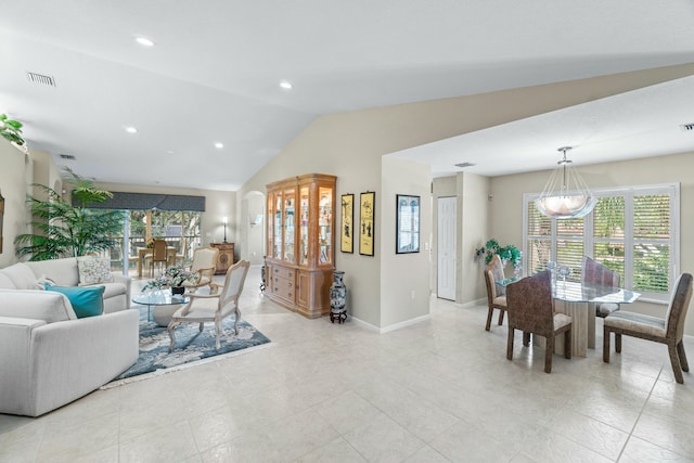 living room featuring vaulted ceiling