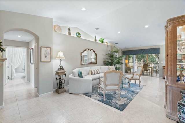 tiled living room with vaulted ceiling