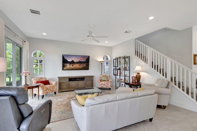 tiled living room featuring ceiling fan