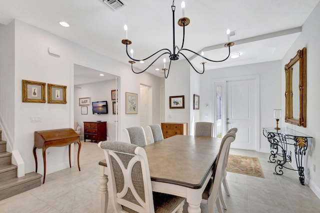 dining area featuring an inviting chandelier