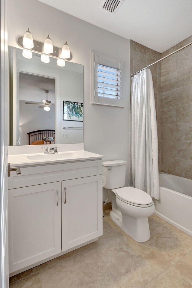 full bathroom with ceiling fan, toilet, vanity, and shower / tub combo with curtain