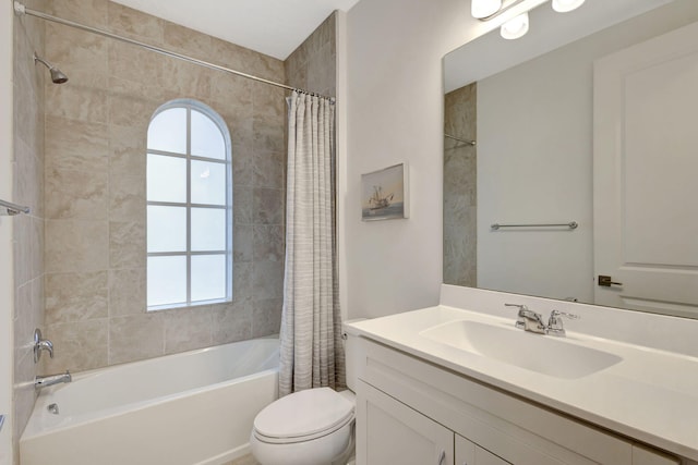 full bathroom featuring vanity, shower / tub combo, and toilet