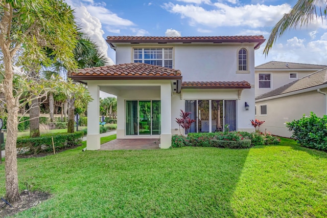 rear view of property with a yard