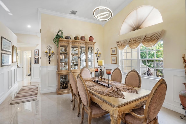 dining room featuring crown molding