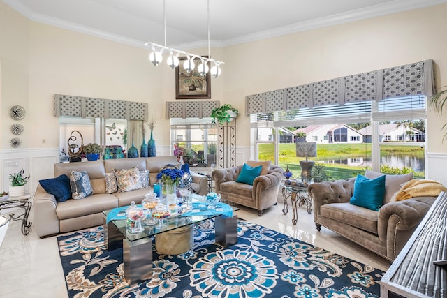 living room featuring ornamental molding and a chandelier