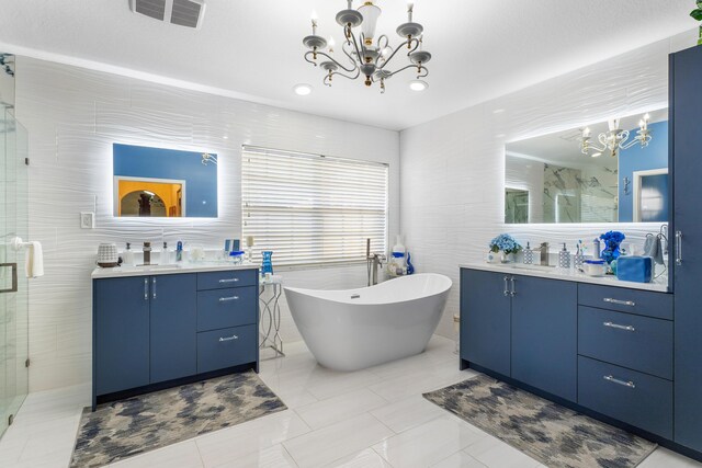 bathroom featuring vanity, separate shower and tub, tile walls, and a chandelier