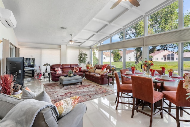 sunroom with ceiling fan, lofted ceiling, and an AC wall unit