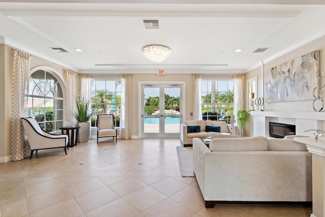 tiled living room featuring french doors and ornamental molding