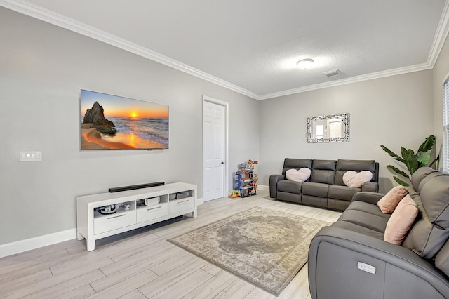 living room featuring a textured ceiling, light wood-type flooring, and crown molding