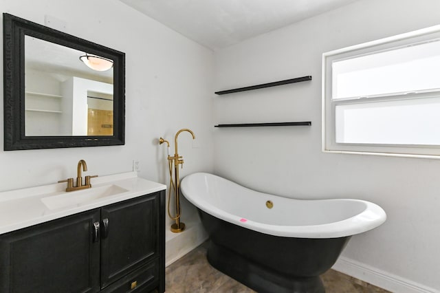 bathroom with vanity, a bath, and wood-type flooring